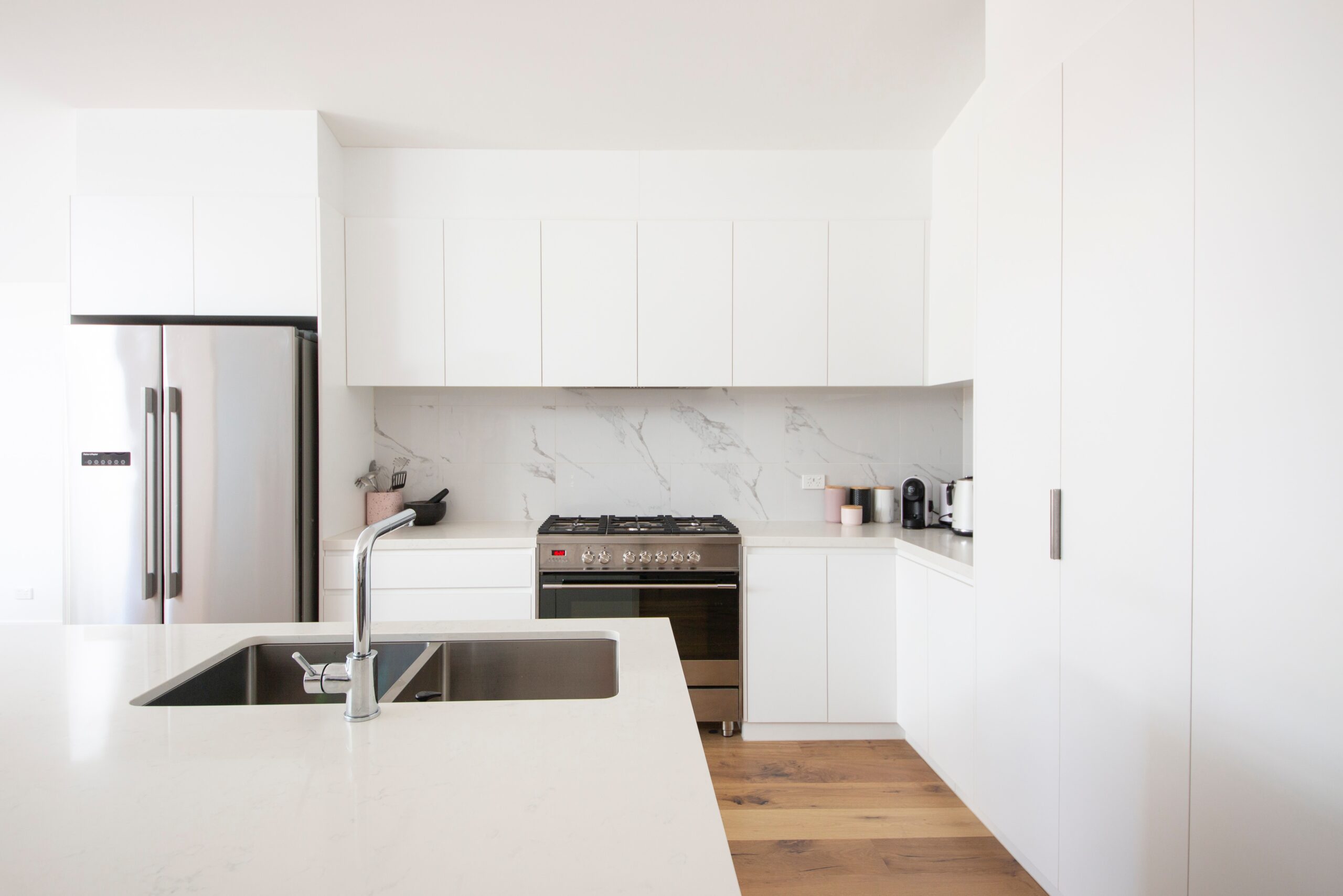 White kitchen with sink and oven